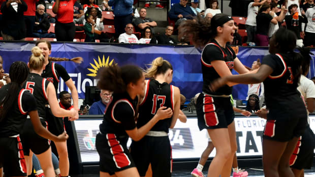 Fort Myers Evangelical Christian Academy players celebrate after winning the Class 2A girls basketball state championship on Thursday at the RP Funding Center in Lakeland.